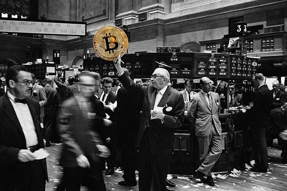 A stock trader on the floor of the NYSE in 1963, photoshopped to show him holding up a large physical “bitcoin”
