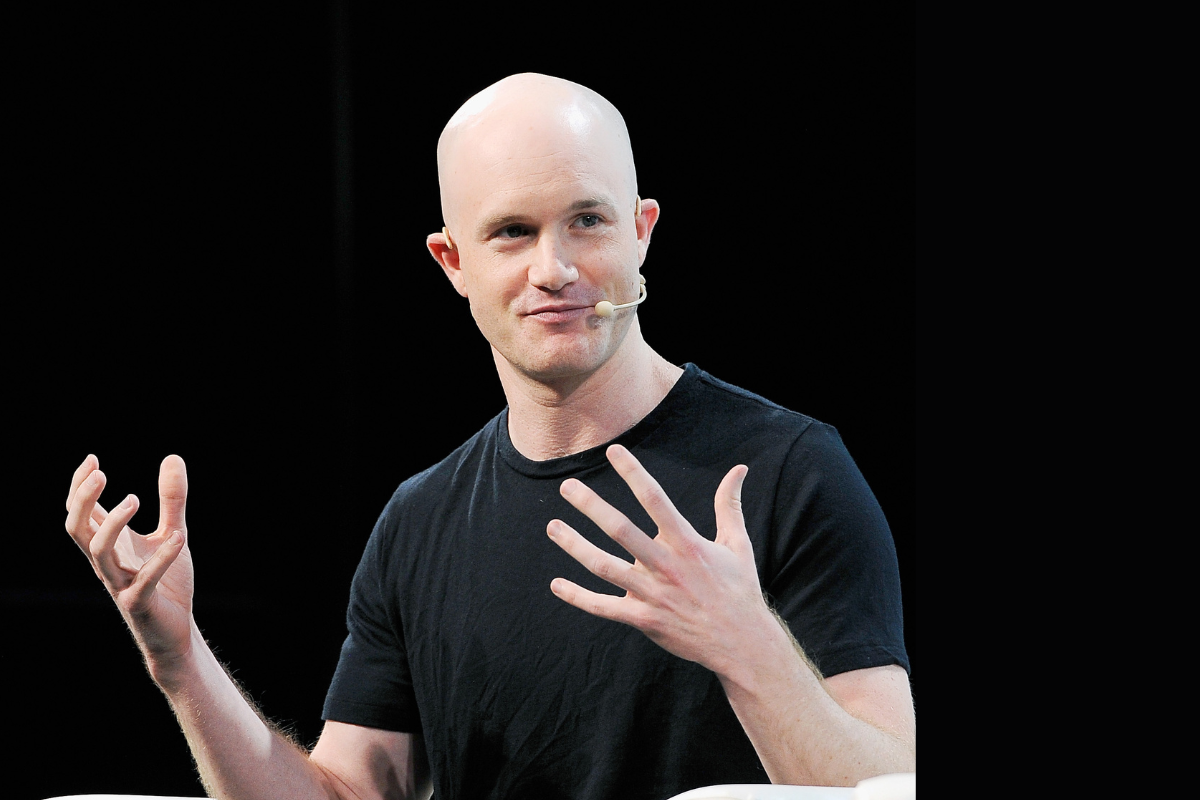 Coinbase CEO Brian Armstrong gestures with his hands in front of him